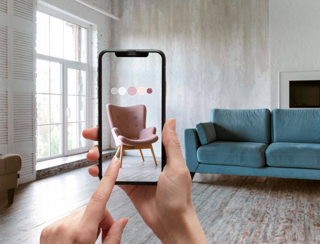 A phone held over a sitting room displaying an AR generated chair that fits in the sitting room